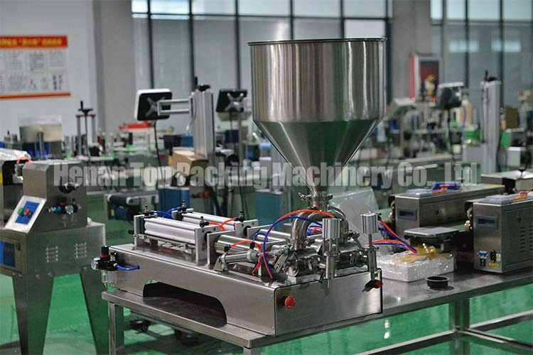 Double outlet liquid & paste filler in factory
